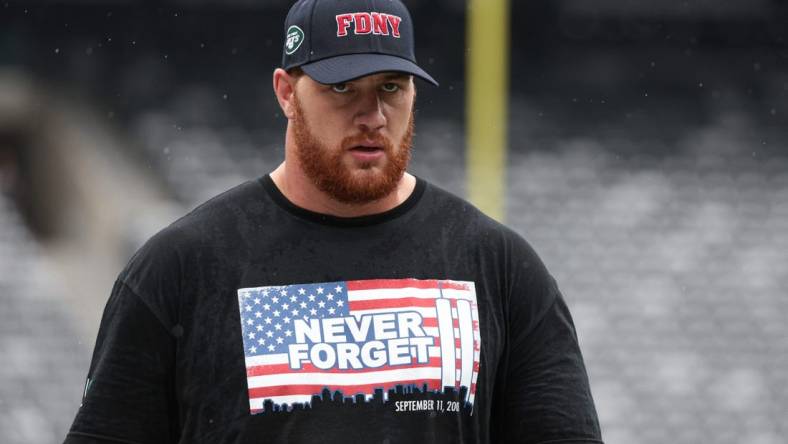 Sep 11, 2022; East Rutherford, New Jersey, USA; New York Jets offensive tackle Conor McDermott (69) warms up while wearing a shirt honoring the victims of 9/11 before the game against the Baltimore Ravens at MetLife Stadium. Mandatory Credit: Vincent Carchietta-USA TODAY Sports