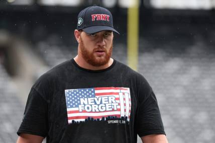Sep 11, 2022; East Rutherford, New Jersey, USA; New York Jets offensive tackle Conor McDermott (69) warms up while wearing a shirt honoring the victims of 9/11 before the game against the Baltimore Ravens at MetLife Stadium. Mandatory Credit: Vincent Carchietta-USA TODAY Sports