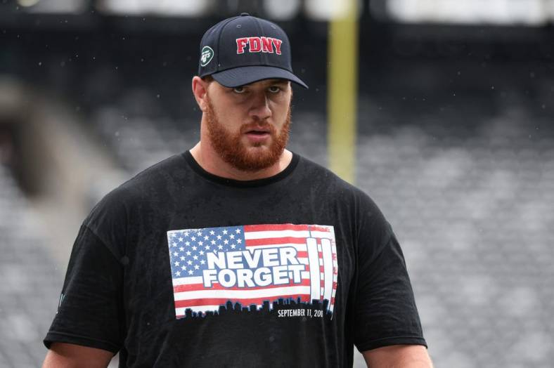 Sep 11, 2022; East Rutherford, New Jersey, USA; New York Jets offensive tackle Conor McDermott (69) warms up while wearing a shirt honoring the victims of 9/11 before the game against the Baltimore Ravens at MetLife Stadium. Mandatory Credit: Vincent Carchietta-USA TODAY Sports
