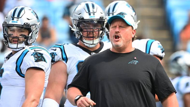 Sep 11, 2022; Charlotte, North Carolina, USA;  Carolina Panthers offensive coach Ben McAdoo and Baker Mayfield on the field before the game at Bank of America Stadium. Mandatory Credit: Bob Donnan-USA TODAY Sports