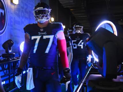 Sep 11, 2022; Nashville, Tennessee, USA; Tennessee Titans offensive tackle Taylor Lewan (77) takes the field for warmups before the game against the New York Giants at Nissan Stadium. Mandatory Credit: Christopher Hanewinckel-USA TODAY Sports