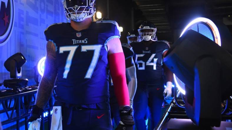 Sep 11, 2022; Nashville, Tennessee, USA; Tennessee Titans offensive tackle Taylor Lewan (77) takes the field for warmups before the game against the New York Giants at Nissan Stadium. Mandatory Credit: Christopher Hanewinckel-USA TODAY Sports