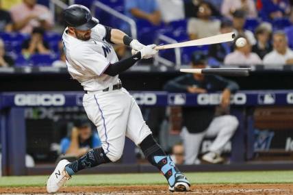 Sep 21, 2022; Miami, Florida, USA; Miami Marlins left fielder Jon Berti (5) breaks his bat during the third inning against the Chicago Cubs at loanDepot Park. Mandatory Credit: Sam Navarro-USA TODAY Sports