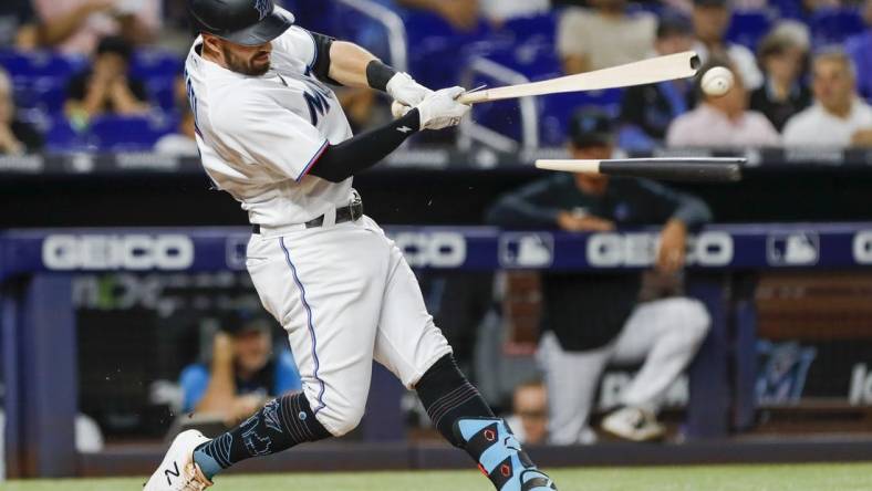 Sep 21, 2022; Miami, Florida, USA; Miami Marlins left fielder Jon Berti (5) breaks his bat during the third inning against the Chicago Cubs at loanDepot Park. Mandatory Credit: Sam Navarro-USA TODAY Sports