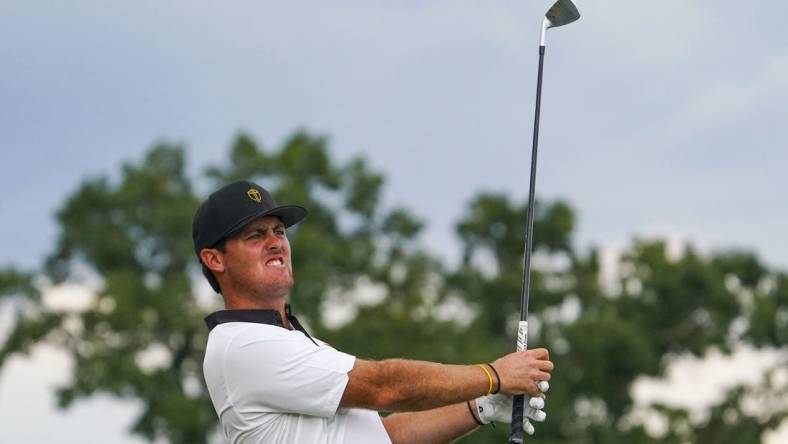 Sep 22, 2022; Charlotte, North Carolina, USA; International Team golfer Mito Pereira hits his tee shot on the 14th hole during the foursomes match play of the Presidents Cup golf tournament at Quail Hollow Club. Mandatory Credit: Peter Casey-USA TODAY Sports