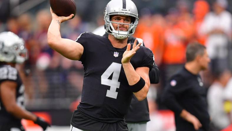 Oct 2, 2022; Paradise, Nevada, USA; Las Vegas Raiders quarterback Derek Carr (4) before playing against the Denver Broncos at Allegiant Stadium. Mandatory Credit: Gary A. Vasquez-USA TODAY Sports