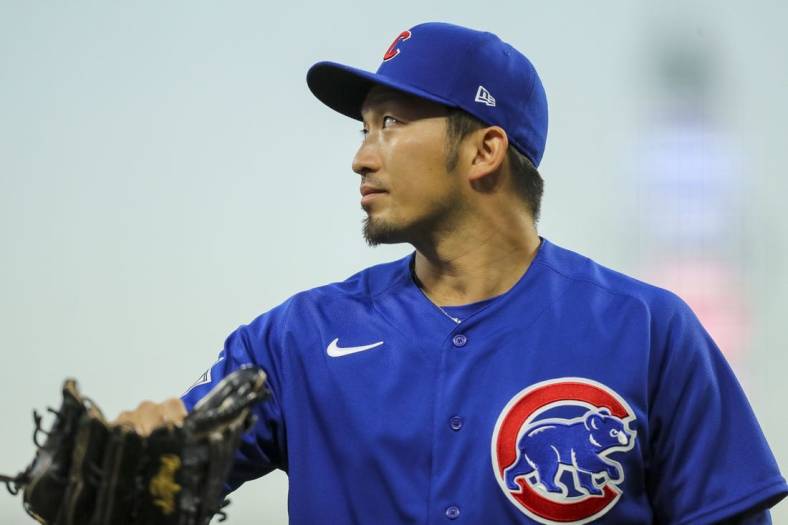 Oct 4, 2022; Cincinnati, Ohio, USA; Chicago Cubs right fielder Seiya Suzuki (27) walks off the field at the end of the second inning against the Cincinnati Reds at Great American Ball Park. Mandatory Credit: Katie Stratman-USA TODAY Sports