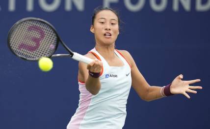 Oct 13, 2022; San Diego, California, US;  Qinwen Zheng of China hits the ball against Iga Swiatek of Poland during the San Diego Open at Barnes Tennis Center. Mandatory Credit: Ray Acevedo-USA TODAY Sports