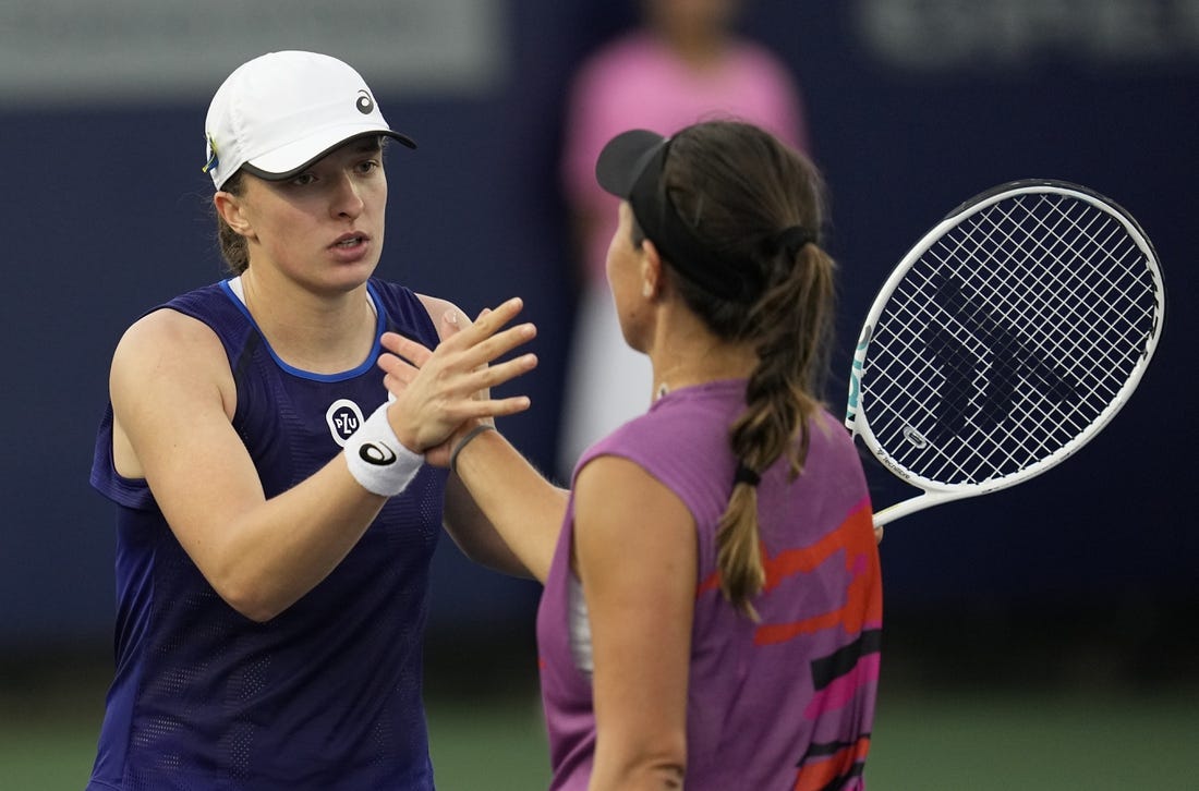 Oct 15, 2022; San Diego, California, US;  Iga Swiatek of Poland (left) greets Jessica Pegula of the United States after her win during the San Diego Open at Barnes Tennis Center. Mandatory Credit: Ray Acevedo-USA TODAY Sports