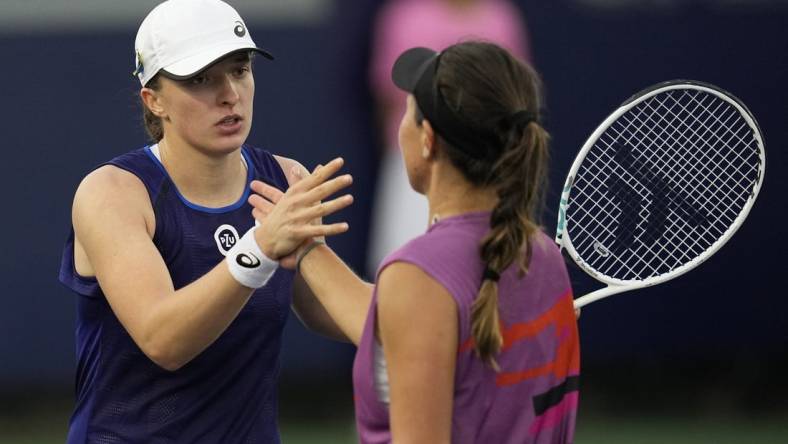 Oct 15, 2022; San Diego, California, US;  Iga Swiatek of Poland (left) greets Jessica Pegula of the United States after her win during the San Diego Open at Barnes Tennis Center. Mandatory Credit: Ray Acevedo-USA TODAY Sports