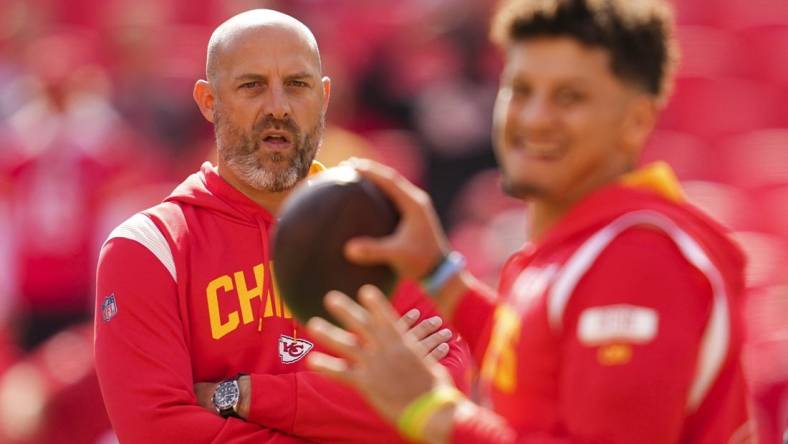 Oct 16, 2022; Kansas City, Missouri, USA; Kansas City Chiefs quarterback coach Matt Nagy watches as quarterback Patrick Mahomes (15) warms up prior to a game against the Buffalo Bills at GEHA Field at Arrowhead Stadium. Mandatory Credit: Jay Biggerstaff-USA TODAY Sports