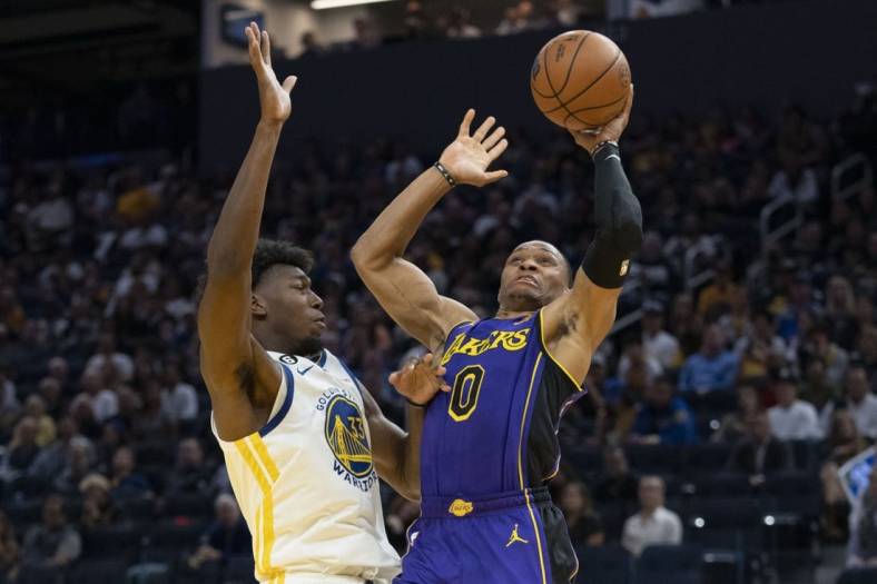 October 18, 2022; San Francisco, California, USA; Los Angeles Lakers guard Russell Westbrook (0) shoots the basketball against Golden State Warriors center James Wiseman (33) during the third quarter at Chase Center. Mandatory Credit: Kyle Terada-USA TODAY Sports