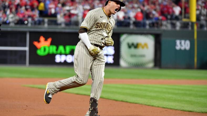 Oct 22, 2022; Philadelphia, Pennsylvania, USA; San Diego Padres third baseman Manny Machado (13) reacts after hitting a home run in the first inning during game four of the NLCS against the Philadelphia Phillies for the 2022 MLB Playoffs at Citizens Bank Park.Mandatory Credit: Eric Hartline-USA TODAY Sports