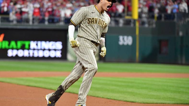 Oct 22, 2022; Philadelphia, Pennsylvania, USA; San Diego Padres third baseman Manny Machado (13) reacts after hitting a home run in the first inning during game four of the NLCS against the Philadelphia Phillies for the 2022 MLB Playoffs at Citizens Bank Park.Mandatory Credit: Eric Hartline-USA TODAY Sports