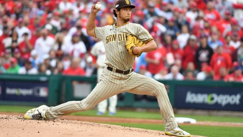 Oct 23, 2022; Philadelphia, Pennsylvania, USA; San Diego Padres starting pitcher Yu Darvish (11) pitches in the first inning during game five of the NLCS against the Philadelphia Phillies for the 2022 MLB Playoffs at Citizens Bank Park. Mandatory Credit: Eric Hartline-USA TODAY Sports