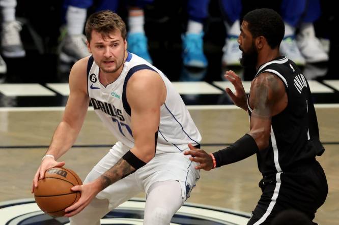 Oct 27, 2022; Brooklyn, New York, USA; Dallas Mavericks guard Luka Doncic (77) controls the ball against Brooklyn Nets guard Kyrie Irving (11) during the first quarter at Barclays Center. Mandatory Credit: Brad Penner-USA TODAY Sports