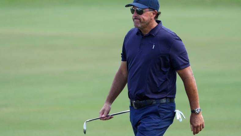 Oct 28, 2022; Miami, Florida, USA; Phil Mickelson walks up the fairway of the first hole during the first round of the season finale of the LIV Golf series at Trump National Doral. Mandatory Credit: Jasen Vinlove-USA TODAY Sports