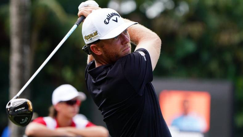 Oct 30, 2022; Miami, Florida, USA; Talor Gooch plays his shot on the 12th tee during the final round of the season finale of the LIV Golf series at Trump National Doral. Mandatory Credit: John David Mercer-USA TODAY Sports