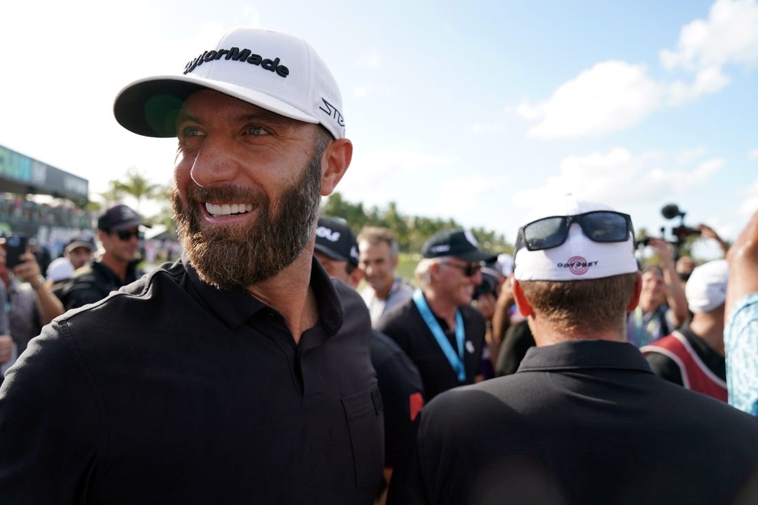 Oct 30, 2022; Miami, Florida, USA; Dustin Johnson celebrates with team 4Aces GC after winning the season finale of the LIV Golf series at Trump National Doral. Mandatory Credit: John David Mercer-USA TODAY Sports