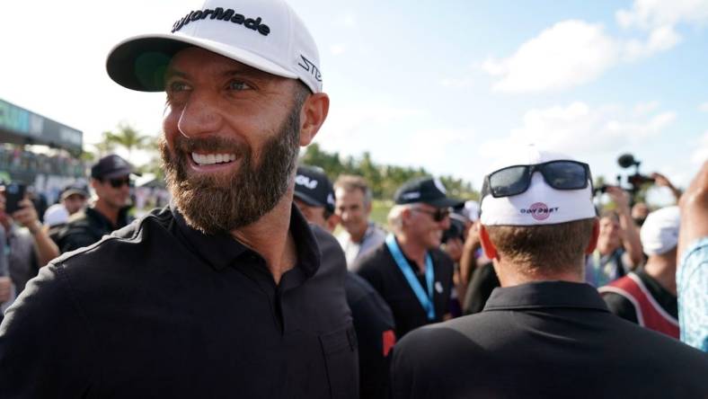 Oct 30, 2022; Miami, Florida, USA; Dustin Johnson celebrates with team 4Aces GC after winning the season finale of the LIV Golf series at Trump National Doral. Mandatory Credit: John David Mercer-USA TODAY Sports