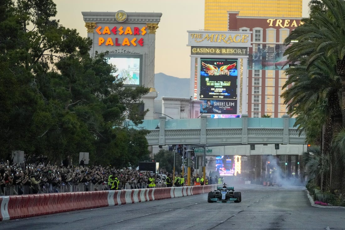 Nov 5, 2022; Las Vegas, Nevada, USA;  Mercedes-AMG Petronas driver George Russell drives on the track during the Formula One Las Vegas Grand Prix Launch Party at Las Vegas Strip. Mandatory Credit: Ray Acevedo-USA TODAY Sports