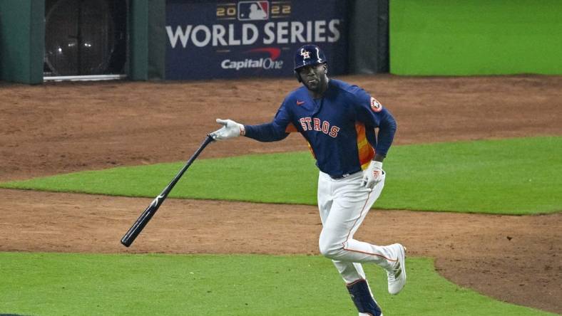 Nov 5, 2022; Houston, Texas, USA; Houston Astros left fielder Yordan Alvarez (44) flips his bat after he hits a three run home run against the Philadelphia Phillies during the sixth inning in game six of the 2022 World Series at Minute Maid Park. Mandatory Credit: Jerome Miron-USA TODAY Sports