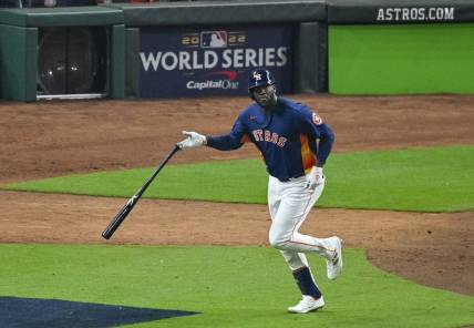 Nov 5, 2022; Houston, Texas, USA; Houston Astros left fielder Yordan Alvarez (44) flips his bat after he hits a three run home run against the Philadelphia Phillies during the sixth inning in game six of the 2022 World Series at Minute Maid Park. Mandatory Credit: Jerome Miron-USA TODAY Sports