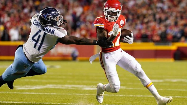 Nov 6, 2022; Kansas City, Missouri, USA; Kansas City Chiefs wide receiver Mecole Hardman (17) runs the ball against Tennessee Titans linebacker Zach Cunningham (41) during the first half at GEHA Field at Arrowhead Stadium. Mandatory Credit: Jay Biggerstaff-USA TODAY Sports