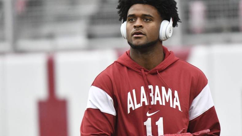 Nov 26, 2022; Tuscaloosa, Alabama, USA; Alabama wide receiver Traeshon Holden (11) goes through his pregame routine before the Crimson Tide faces Auburn at Bryant-Denny Stadium. Mandatory Credit: Gary Cosby Jr.-USA TODAY Sports