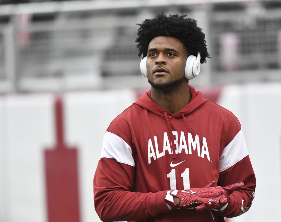 Nov 26, 2022; Tuscaloosa, Alabama, USA; Alabama wide receiver Traeshon Holden (11) goes through his pregame routine before the Crimson Tide faces Auburn at Bryant-Denny Stadium. Mandatory Credit: Gary Cosby Jr.-USA TODAY Sports