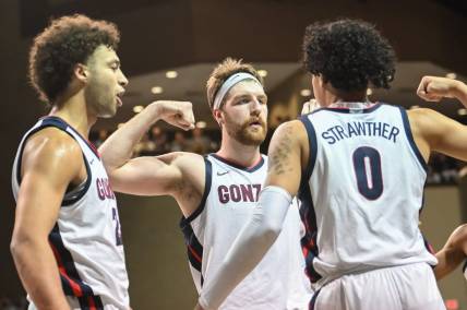 Dec 2, 2022; Sioux Falls, South Dakota, USA;  Gonzaga Bulldogs guard Julian Strawther (0) reacts with forward Drew Timme (2) and forward Anton Watson (22) after a basket against the Baylor Bears in the second half at Sanford Pentagon. Mandatory Credit: Steven Branscombe-USA TODAY Sports