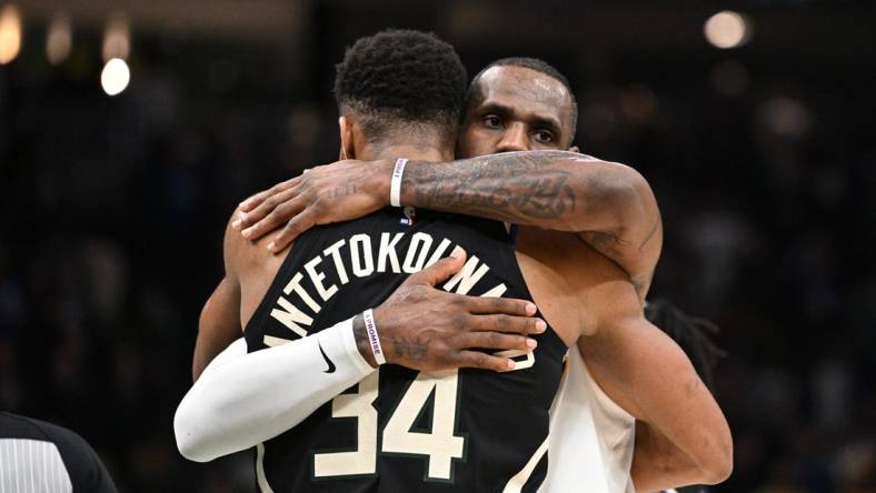 Dec 2, 2022; Milwaukee, Wisconsin, USA; Los Angeles Lakers forward LeBron James (6) and Milwaukee Bucks forward Giannis Antetokounmpo (34) exchange hugs after the Los Angeles Lakers 133-129 win over the Milwaukee Bucks at Fiserv Forum. Mandatory Credit: Michael McLoone-USA TODAY Sports