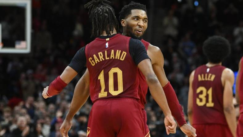 Dec 16, 2022; Cleveland, Ohio, USA; Cleveland Cavaliers guard Darius Garland (10) celebrates with guard Donovan Mitchell (45) during the second half against the Indiana Pacers at Rocket Mortgage FieldHouse. Mandatory Credit: Ken Blaze-USA TODAY Sports