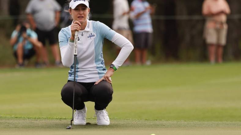 Dec 17, 2022; Orlando, Florida, USA;  Nelly Korda lines up her putt on the ninth green during the first round of the PNC Championship golf tournament at Ritz Carlton Golf Club Grande Lakes Orlando Course. Mandatory Credit: Reinhold Matay-USA TODAY Sports