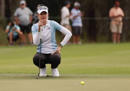 Dec 17, 2022; Orlando, Florida, USA;  Nelly Korda lines up her putt on the ninth green during the first round of the PNC Championship golf tournament at Ritz Carlton Golf Club Grande Lakes Orlando Course. Mandatory Credit: Reinhold Matay-USA TODAY Sports