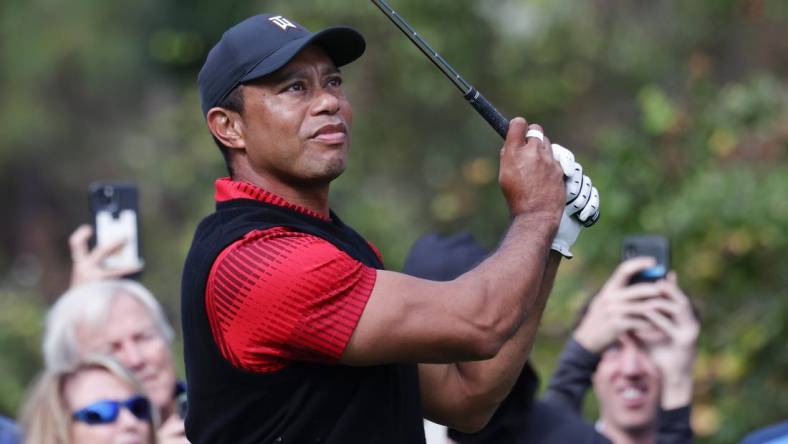 Dec 18, 2022; Orlando, Florida, USA; Tiger Woods watches his drive on the third hole during the final round of the PNC Championship golf tournament at Ritz Carlton Golf Club Grande Lakes Orlando Course. Mandatory Credit: Reinhold Matay-USA TODAY Sports