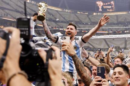 Dec 18, 2022; Lusail, Qatar; Argentina forward Lionel Messi (10) celebrates with fans after winning the 2022 World Cup final against France at Lusail Stadium. Mandatory Credit: Yukihito Taguchi-USA TODAY Sports