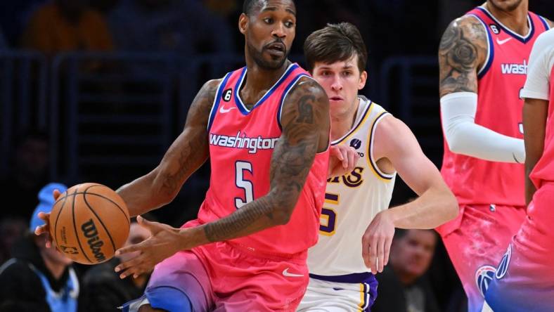 Dec 18, 2022; Los Angeles, California, USA; Los Angeles Lakers guard Austin Reaves (15) chases down Washington Wizards forward Will Barton (5) in the first half at Crypto.com Arena. Mandatory Credit: Jayne Kamin-Oncea-USA TODAY Sports