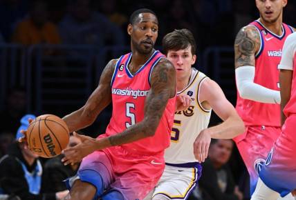 Dec 18, 2022; Los Angeles, California, USA; Los Angeles Lakers guard Austin Reaves (15) chases down Washington Wizards forward Will Barton (5) in the first half at Crypto.com Arena. Mandatory Credit: Jayne Kamin-Oncea-USA TODAY Sports