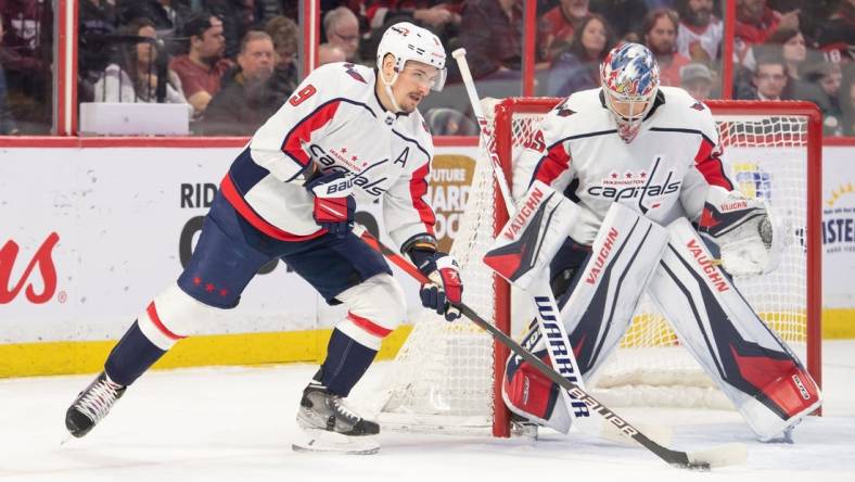 Dec 22, 2022; Ottawa, Ontario, CAN; Washington Capitals defenseman Dmitry Orlov (9) skates with the puck in the first period against the Ottawa Senators at the Canadian Tire Centre. Mandatory Credit: Marc DesRosiers-USA TODAY Sports