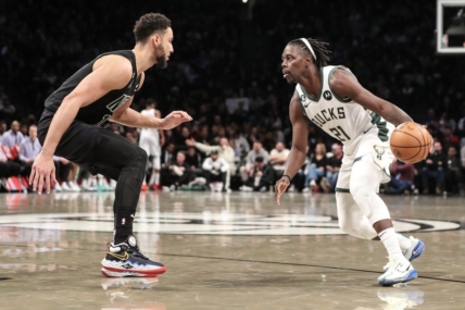 Dec 23, 2022; Brooklyn, New York, USA;  Milwaukee Bucks guard Jrue Holiday (21) looks to drive past Brooklyn Nets guard Ben Simmons (10) in the second quarter at Barclays Center. Mandatory Credit: Wendell Cruz-USA TODAY Sports