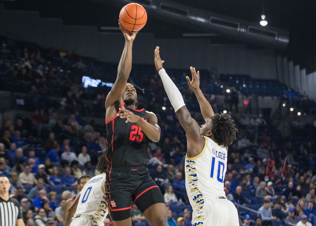 Dec 28, 2022; Tulsa, Oklahoma, USA; Houston Cougars forward Jarace Walker (25) shoots over Tulsa Golden Hurricane forward Tim Dalger (10) during the second half at Reynolds Center. Houston won 89 - 50. Mandatory Credit: Brett Rojo-USA TODAY Sports