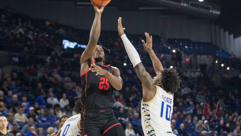 Dec 28, 2022; Tulsa, Oklahoma, USA; Houston Cougars forward Jarace Walker (25) shoots over Tulsa Golden Hurricane forward Tim Dalger (10) during the second half at Reynolds Center. Houston won 89 - 50. Mandatory Credit: Brett Rojo-USA TODAY Sports