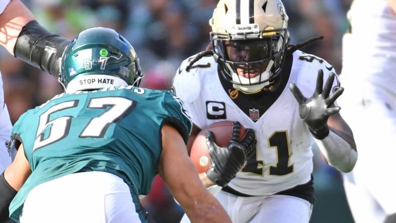 Jan 1, 2023; Philadelphia, Pennsylvania, USA; New Orleans Saints running back Alvin Kamara (41) carries the ball against Philadelphia Eagles linebacker T.J. Edwards (57) during the second quarter at Lincoln Financial Field. Mandatory Credit: Eric Hartline-USA TODAY Sports