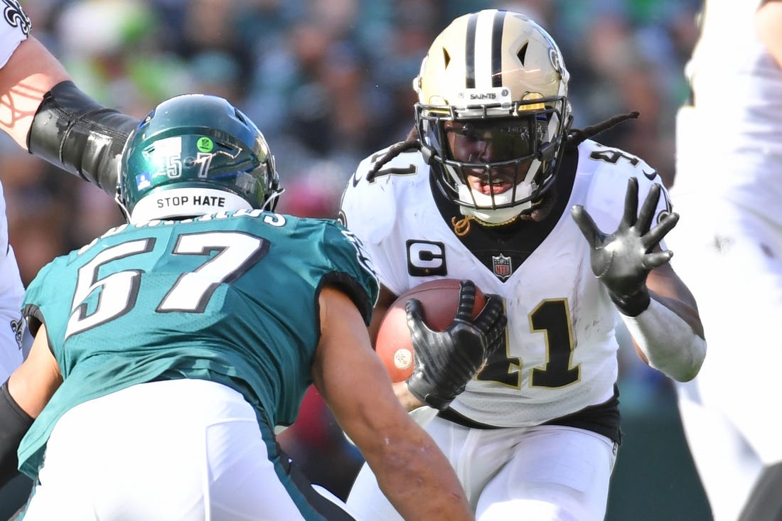 Jan 1, 2023; Philadelphia, Pennsylvania, USA; New Orleans Saints running back Alvin Kamara (41) carries the ball against Philadelphia Eagles linebacker T.J. Edwards (57) during the second quarter at Lincoln Financial Field. Mandatory Credit: Eric Hartline-USA TODAY Sports