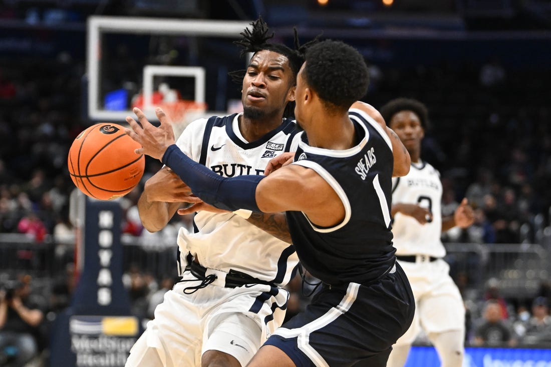 Jan 1, 2023; Washington, District of Columbia, USA; Butler Bulldogs guard Jayden Taylor (13) is fouled by Georgetown Hoyas guard Primo Spears (1) during the second half at Capital One Arena. Mandatory Credit: Brad Mills-USA TODAY Sports