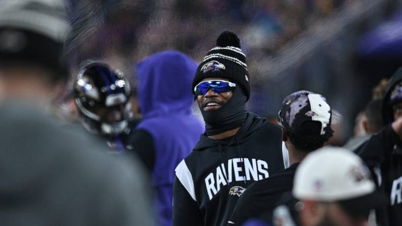 Jan 1, 2023; Baltimore, Maryland, USA;  Baltimore Ravens quarterback Lamar Jackson (8) stands on the sidelines during the second  half against the Pittsburgh Steelers at M&T Bank Stadium. Mandatory Credit: Tommy Gilligan-USA TODAY Sports