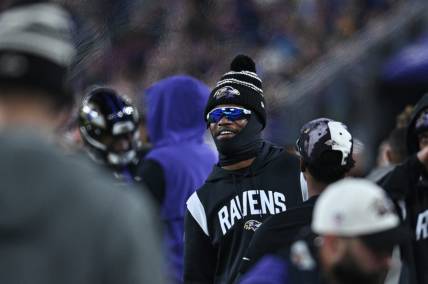 Jan 1, 2023; Baltimore, Maryland, USA;  Baltimore Ravens quarterback Lamar Jackson (8) stands on the sidelines during the second  half against the Pittsburgh Steelers at M&T Bank Stadium. Mandatory Credit: Tommy Gilligan-USA TODAY Sports