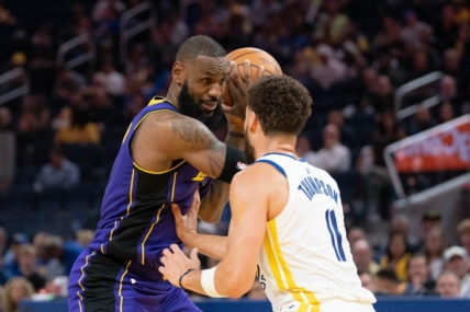 October 18, 2022; San Francisco, California, USA; Los Angeles Lakers forward LeBron James (6) controls the basketball against Golden State Warriors guard Klay Thompson (11) during the third quarter at Chase Center. Mandatory Credit: Kyle Terada-USA TODAY Sports