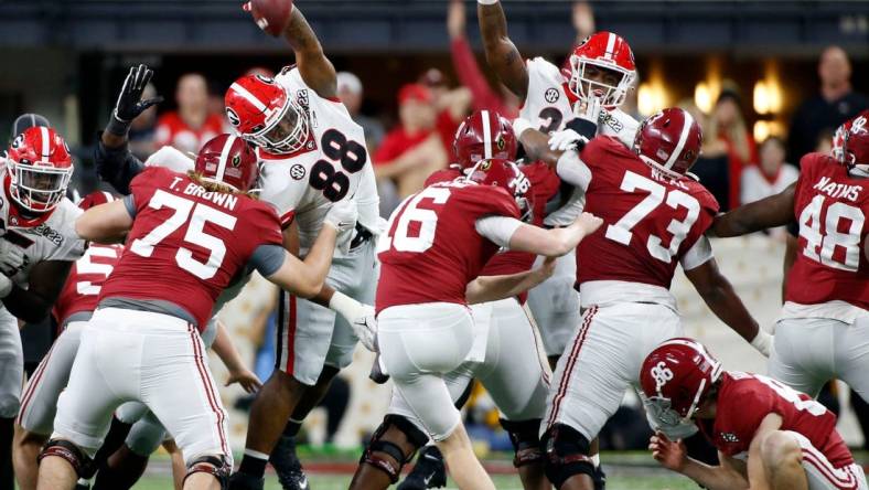 Georgia Bulldogs defensive lineman Jalen Carter (88) blocks a field goal attempt by Alabama Crimson Tide place kicker Will Reichard (16) on Monday, Jan. 10, 2022, during the College Football Playoff National Championship at Lucas Oil Stadium in Indianapolis.

Syndication The Indianapolis Star